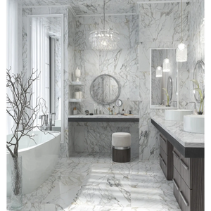 Modern bathroom with marble walls and floor, featuring a freestanding bathtub and double vanity.