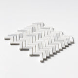 Close-up of Carrara Neptune Honed Herringbone Marble Mosaic showing fine Italian marble texture.
