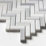 Bathroom wall with Carrara Neptune Honed Herringbone Marble Mosaic Tiles white marble classic layout.
