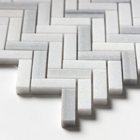Bathroom wall with Carrara Neptune Honed Herringbone Marble Mosaic Tiles white marble classic layout.
