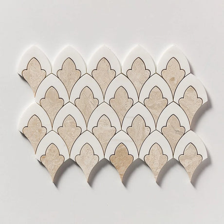 A sheet of scalloped mosaic tiles with alternating beige stone and white pieces outlined in dark brown, arranged in a fan pattern on a light gray background.